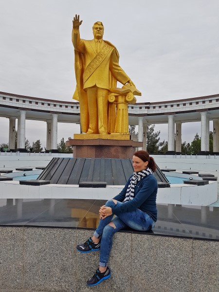At one of the many Turkmenbashi statues in Ashgabat