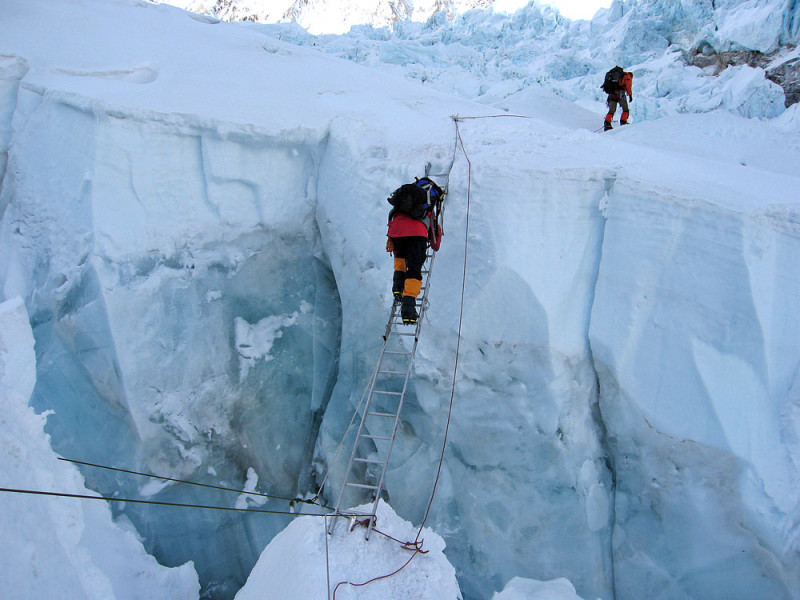 Traversing a crevasse on Mount Everest