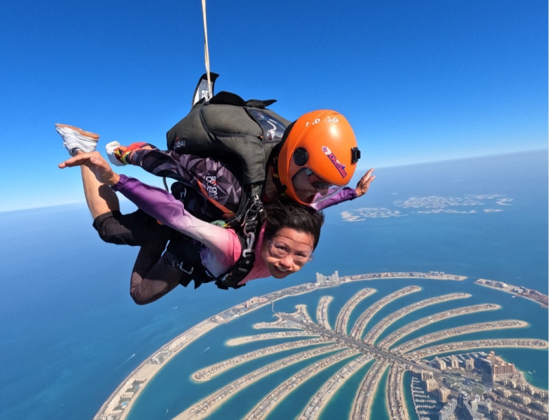 Ernestine Chan skydiving in Dubai with the Palm in the background