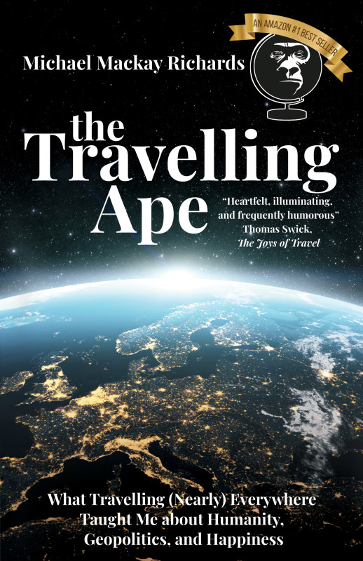 Book cover featuring 'The Travelling Ape' by Mike Richards. The cover depicts a compelling image with a visual narrative that hints at the exploration of humanity, geopolitics, and happiness through the author's travel experiences.