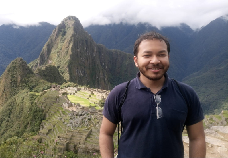 Raiiq Ridwan, Bangladeshi traveller in front of Machu Picchu, Peru